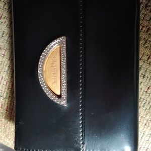 Christian Dior small fold over wallet.